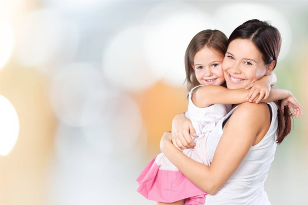 Mother and daughter hugging   - 写真・画像