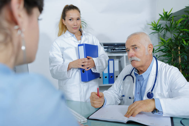 doctor and patient are discussing something - Photo, image