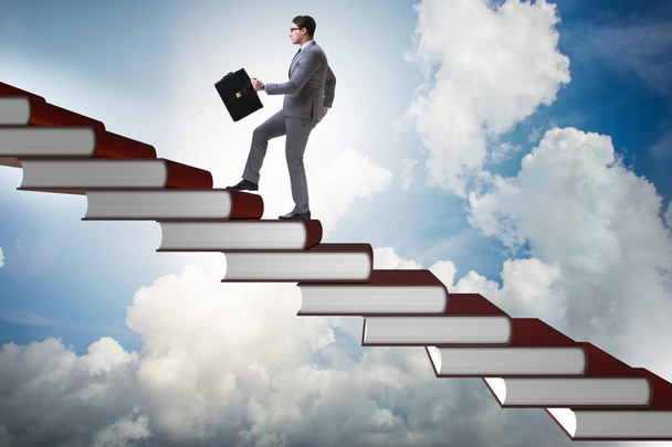 Businessman student climbing the ladder of education books - Photo, Image
