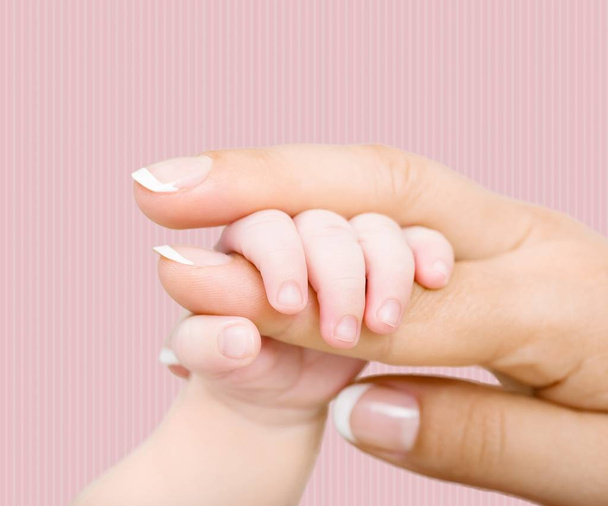 New born baby hand on light background  - Valokuva, kuva