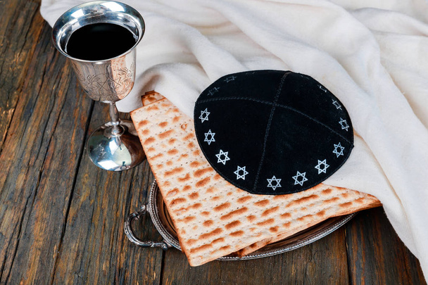 Silver wine cup with matzah, Jewish symbols for the Passover Pesach holiday. Passover concept. - Photo, Image