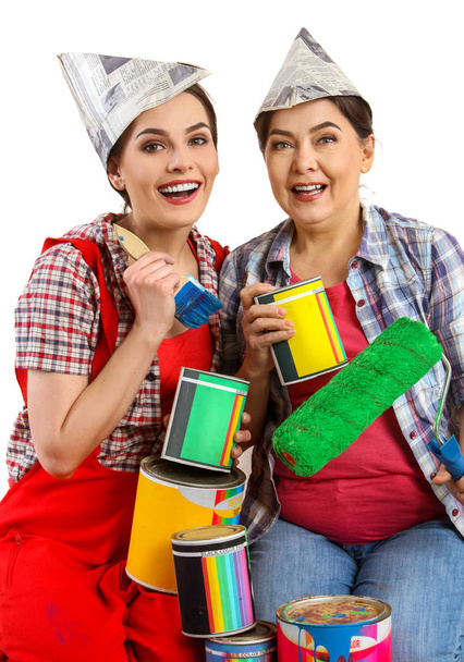 Repair home women holding Bank with paint for wallpaper. - Photo, Image
