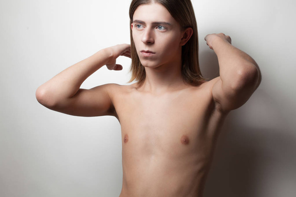 androgynous young man posing topless on white background - Photo, Image