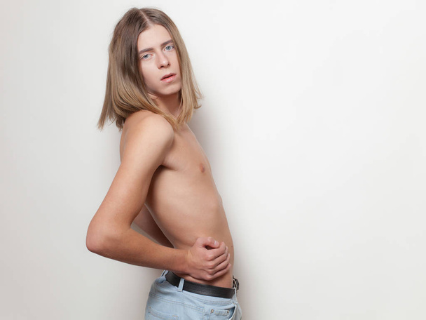 androgynous young man posing topless on white background - Fotoğraf, Görsel