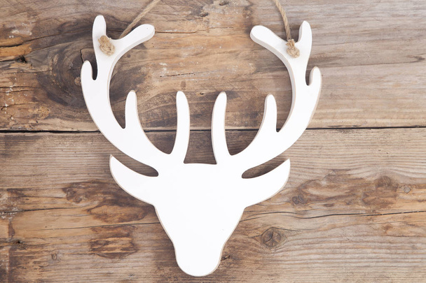 Wooden moose head on wooden background - Photo, Image