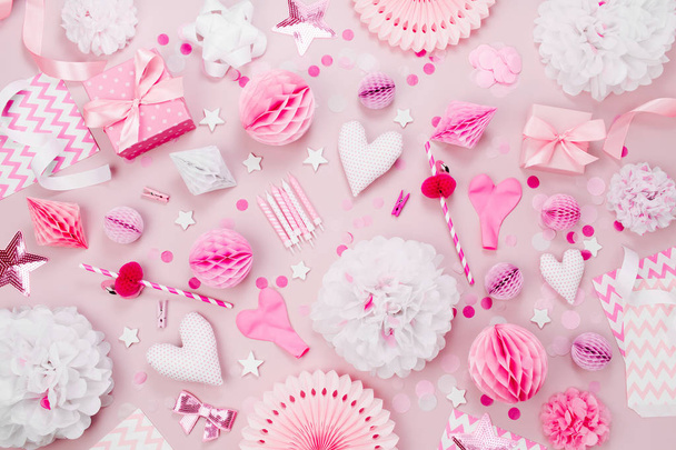 Pink and white Paper Decorations, pom-pom, candy, hearts, gifts, confetti for Baby party. Birthday concept.  Flat lay, top view - Fotoğraf, Görsel
