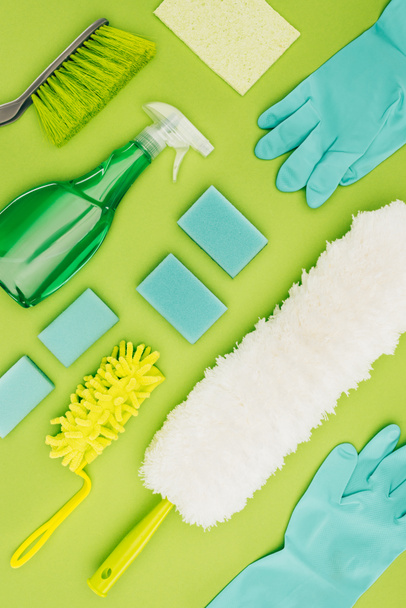 top view of cleaning supplies isolated on light green - Valokuva, kuva