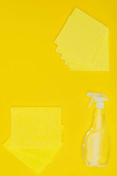 top view of yellow rags and spray bottle isolated on yellow - Photo, Image