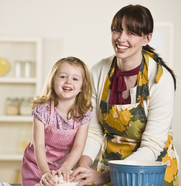 Mom and daughter making bread - Photo, Image