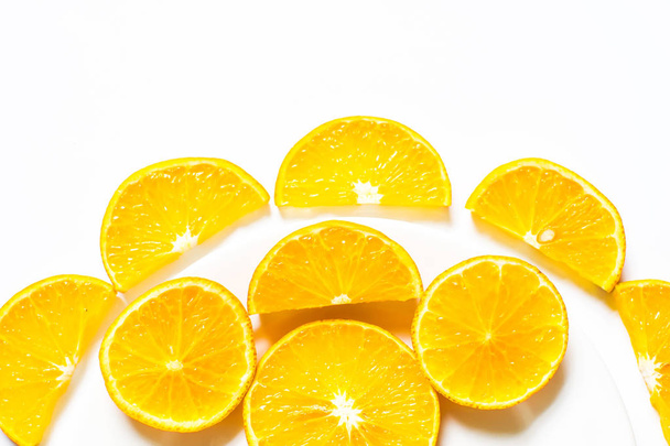 Slices of orange isolated on white background. top view; - Foto, afbeelding
