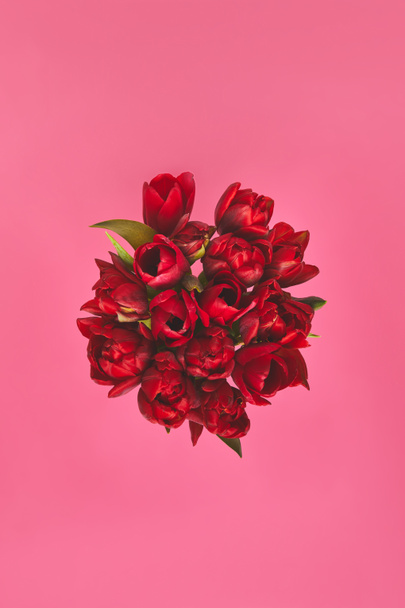 top view of red tulips on pink, mothers day concept - Photo, Image