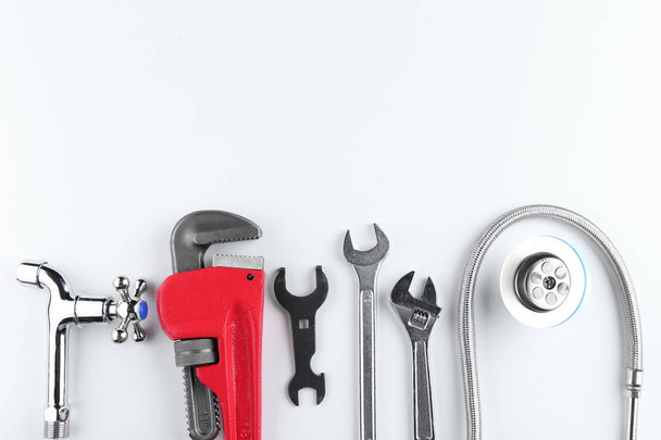 Plumbers items on white - Photo, image