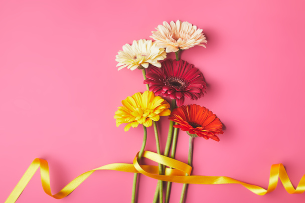 bouquet of colorful Gerbera flowers tied with yellow ribbon, mothers day concept - Photo, Image