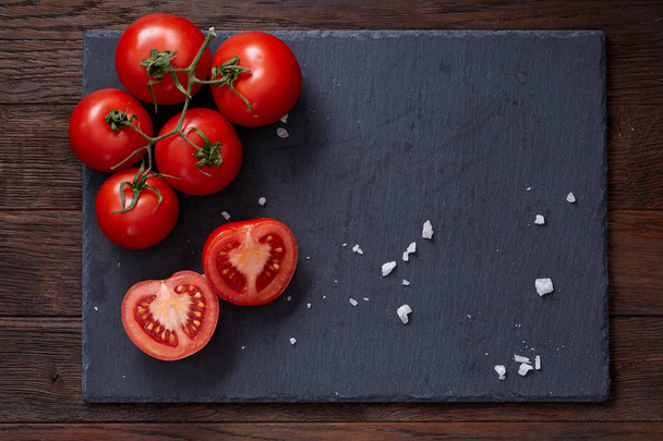 Composition with fresh tomatoes on wooden background, close-up, selective focus. - Foto, immagini