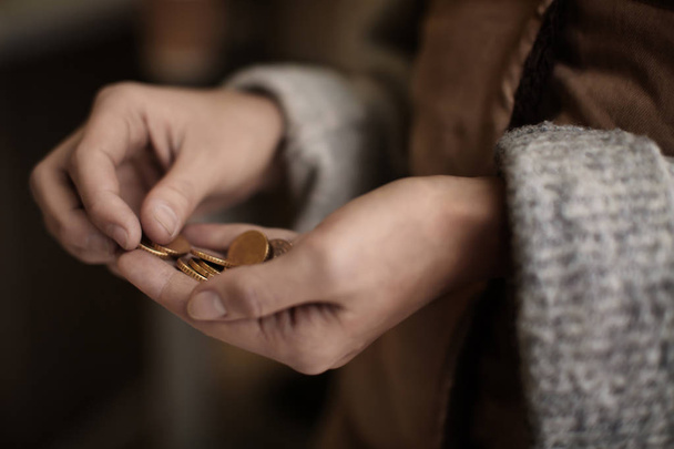Poor woman holding coins, closeup - Foto, immagini