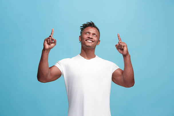 Winning success afro-american man happy ecstatic celebrating being a winner. Dynamic energetic image of male model - Photo, image