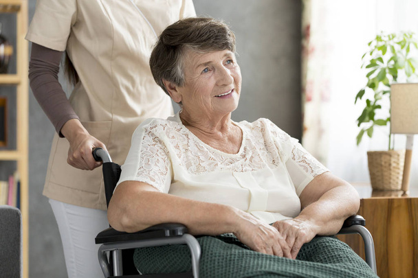 Smiling disabled elderly woman - Φωτογραφία, εικόνα
