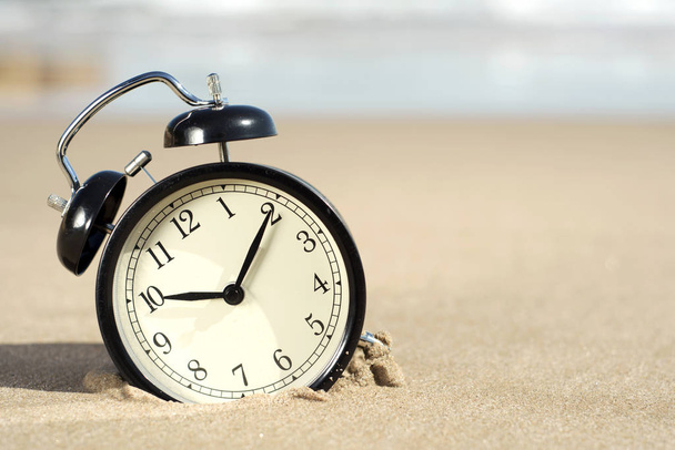 alarm clock on the beach - Photo, Image