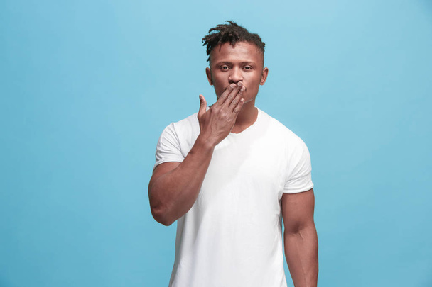 Portrait of attractive Afro-American man with air kiss isolated over blue background - Foto, afbeelding