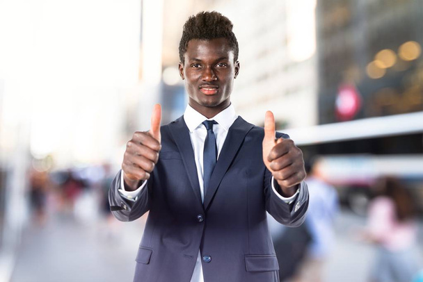 Handsome black man with thumb up - Foto, imagen