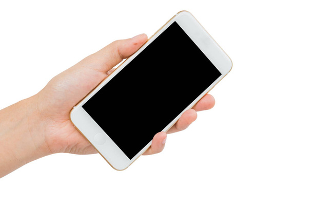 Hand holding gold smartphone on white background - Valokuva, kuva