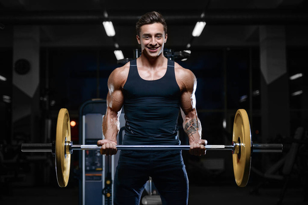 Handsome model young man workout in gym - Fotografie, Obrázek