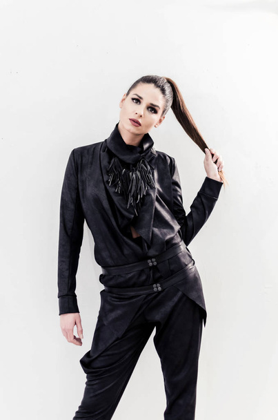 artistic portrait of fashion woman with new and modern clothes design - Foto, afbeelding