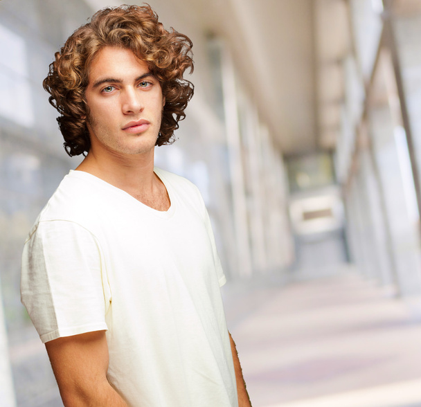 Portrait Of A Serious Young Man Standing - Foto, Imagen