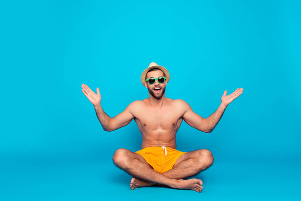 Cheerful, funny, attractive, ladies' man with naked torso in yel - Φωτογραφία, εικόνα