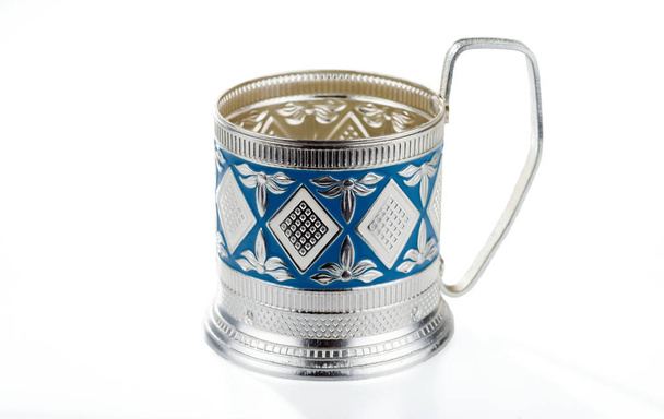 A metallic vintage cup holder with a pattern isolated on white background. Painted in blue. - Photo, Image