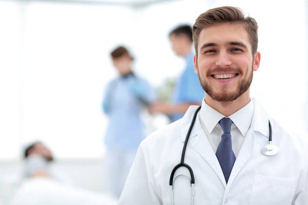 smiling doctor on blurred background - Foto, Imagen