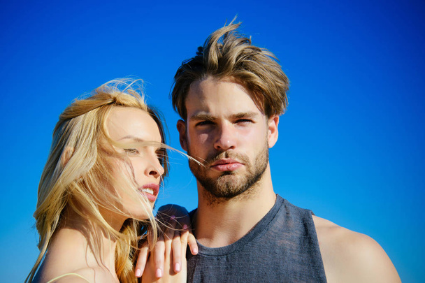 Couple in love on blue sky background. - Fotoğraf, Görsel