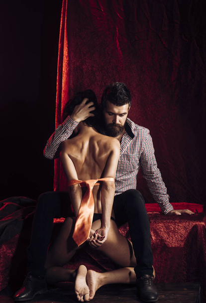Couple in love, bdsm, bearded man and naked girl. - Фото, изображение