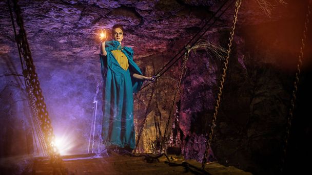 Mysterious witch on the suspension bridge in the dungeon. - Photo, Image