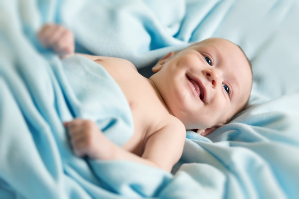Smiling beautiful newborn - Fotoğraf, Görsel