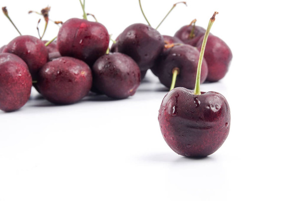 Sweet red cherries isolated on a white background. - 写真・画像