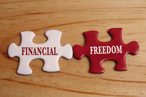 Koncepcja biznesowa: biały i czerwony puzzli z word Financia - Zdjęcie, obraz