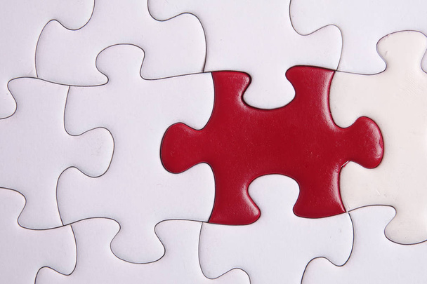 Red puzzle on white background. Copy space - Photo, Image