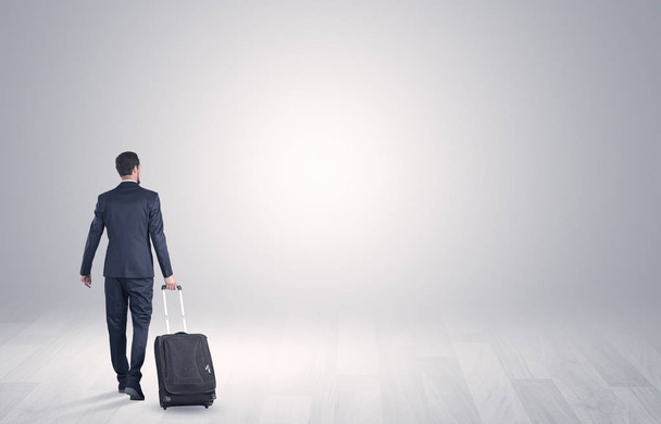 Business with luggage in a boundless space - Photo, image