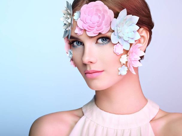Face of beautiful woman decorated with flowers - Φωτογραφία, εικόνα