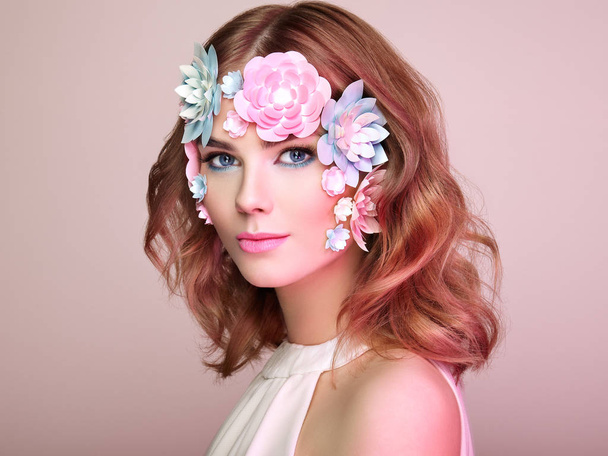 Face of beautiful woman decorated with flowers - Photo, Image