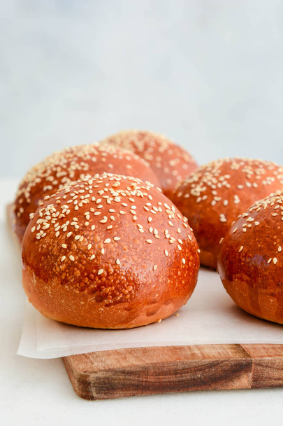Homemade hamburger buns. Tasty buns with sesame  - Fotoğraf, Görsel