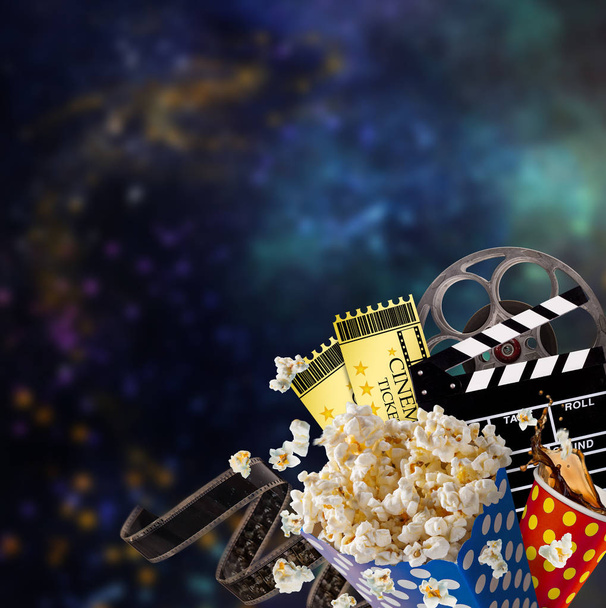 Pop-corn, movie tickets, clapperboard and other things in motion. - Φωτογραφία, εικόνα