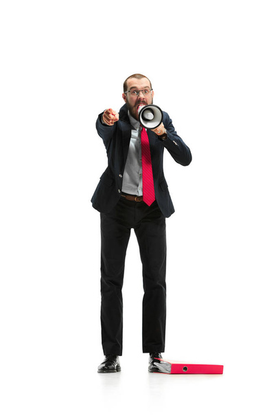 Front view of a man screaming on the megaphone over white background - Foto, afbeelding