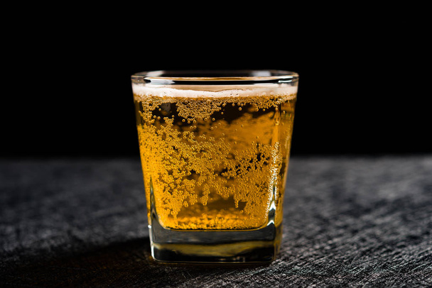 cut of fresh beer on a dark background - Photo, image