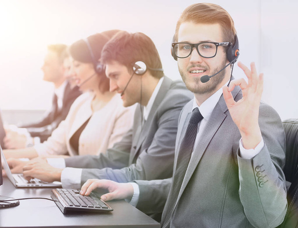 customer service representative with headset showing sign "OK" - Foto, imagen
