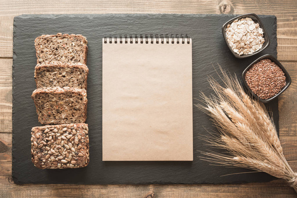 Fitness wholegrain rye bread and space for your text on kraft paper. Top view. Copy space. - Photo, Image
