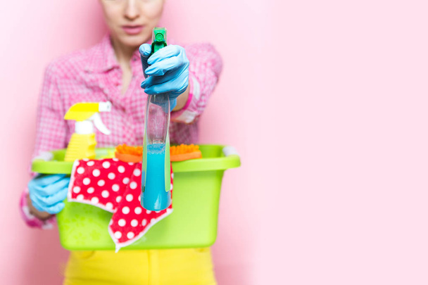 Woman with house supplies ready to to clean room. Spring cleaning concept - Zdjęcie, obraz