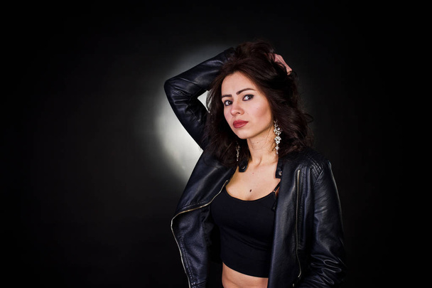 Studio portrait of sexy brunette girl in black leather jacket ag - Foto, Imagem