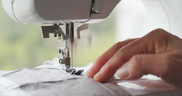 Sewing machine stitching on fabric  - Fotoğraf, Görsel